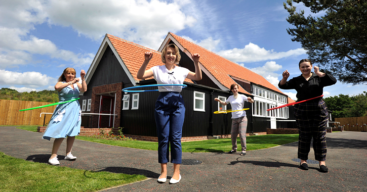 Ladies hula hooping outside the 1950s Welfare Hall at Beamish Museum in County Durham